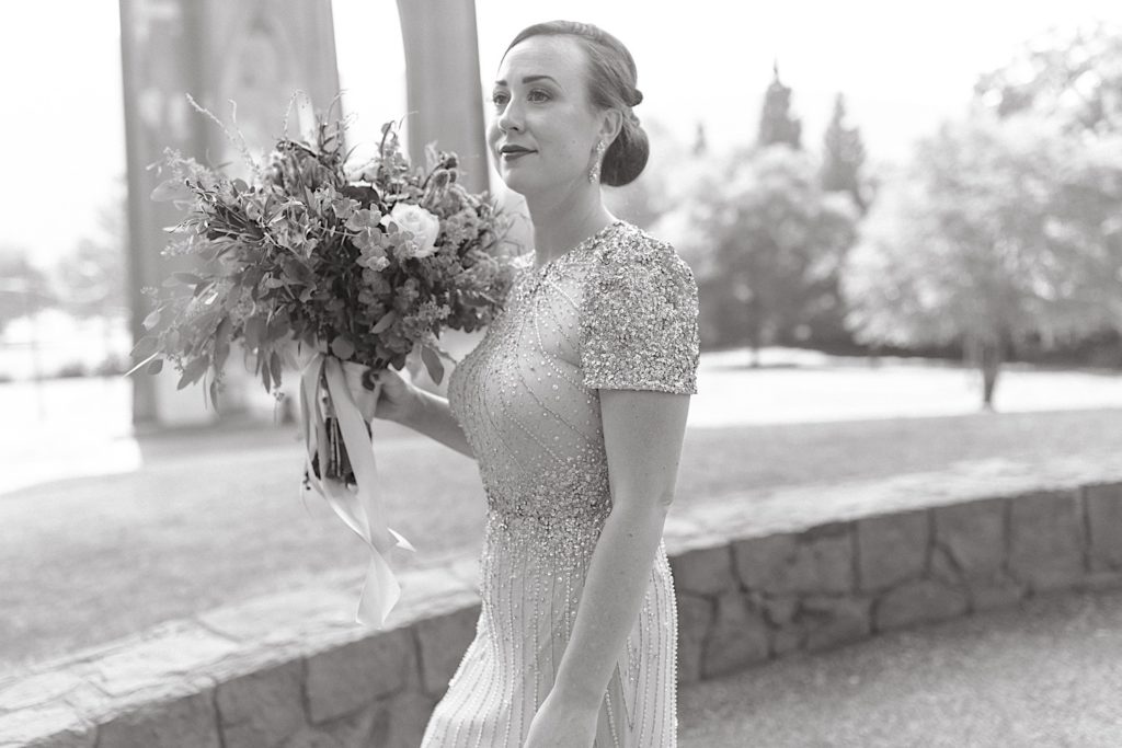 portrait of bride with flowers at cathedral park wedding