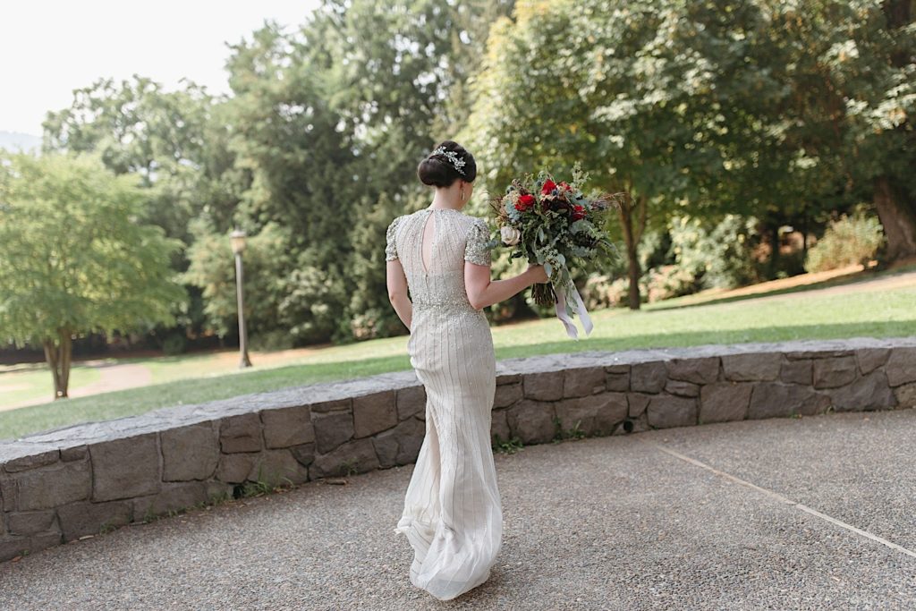 portrait of bride with flowers at cathedral park wedding