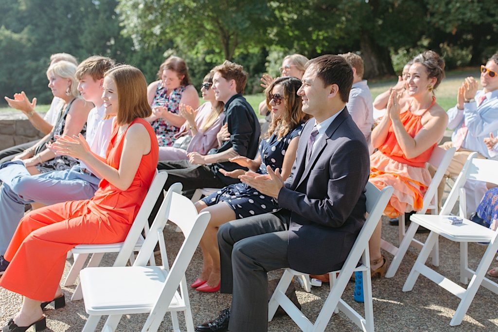 guests clapping after the first kiss at cathedral parking wedding