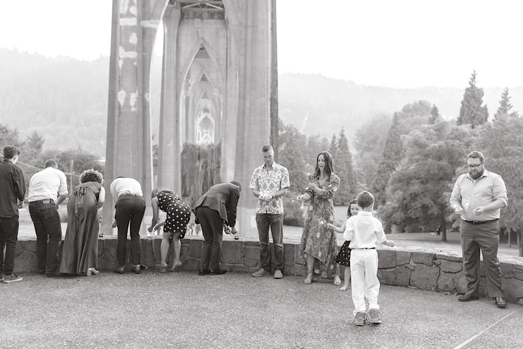 guests lighting sparklers at cathedral park wedding