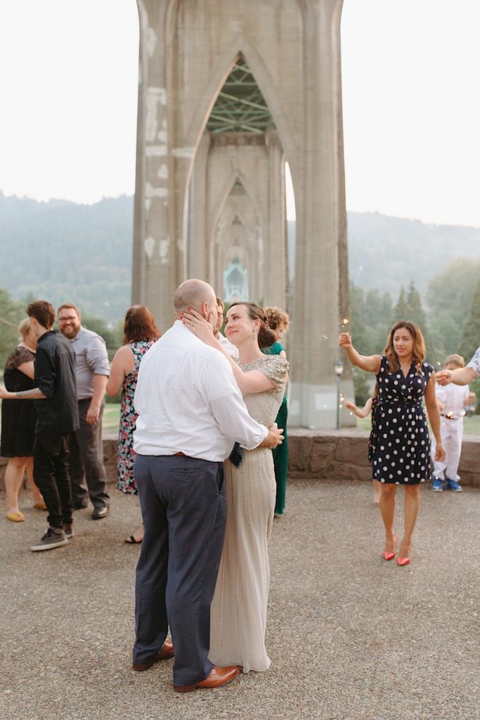 wedding couple at cathedral park having first dance