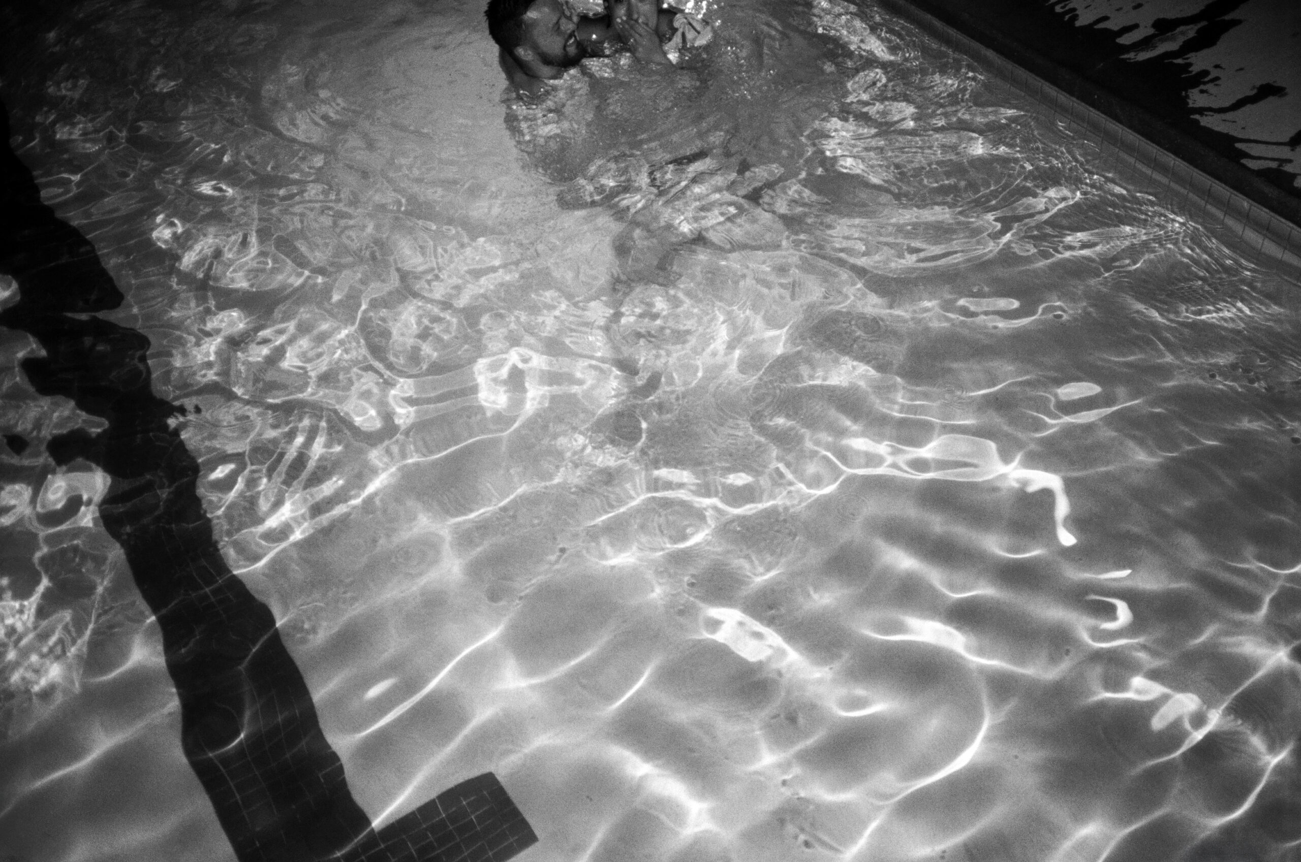 Bride and groom in pool at Brasada Ranch wedding in Bend, Oregon.